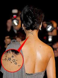 However, in time, rihanna had the tattoo extended so that the stars flowed across her right shoulder blade, too. Rihanna Back Neck Tattoo The Artists Behind Rihanna S Cara Delevingne S And Justin Bieber S Tattoos Vanity Fair I Can T Believe Rihanna S Dumb Neck Tattoo Is A Two Day