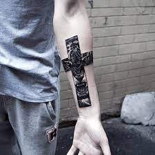 Small fish tattoo on the inner arm. Top 87 Best Cross Tattoos For Men 2021 Inspiration Guide