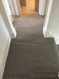 Black And White Striped Carpets Fitted Onto Hall Stairs And Landing Carpet Fitting Carpet Stairs Striped Carpets