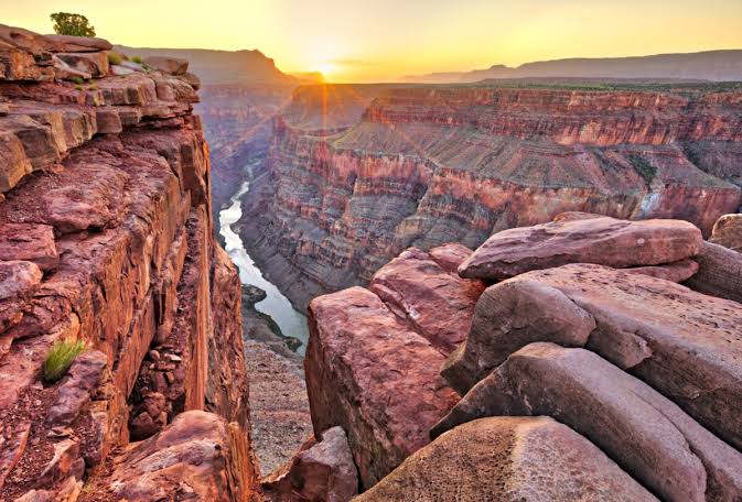 The Grand Canyon South Rim: A vast, high-altitude scale that demands slow exploration., AI generated