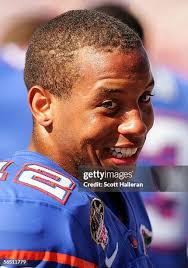 Drew Tate of the Iowa Hawkeyes looks upfield to pass against the... News  Photo