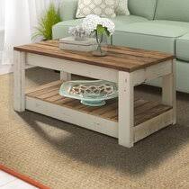Made from reclaimed elm wood, the plank coffee table has a solid silhouette that's deceptively light—a hollow interior makes it easy to move around. Beach Coastal Coffee Table Wayfair