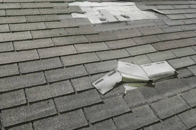 Storm and hail damage on a Pittsburgh asphalt shingle roof that a homeowners insurance claim would cover