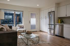Here, a corrugated aluminum exterior distinguishes the converted garage from the rest of the house. Multifamily Garage Conversion To Apartments Case Study Openscope Studio