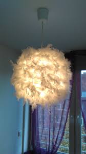 Diy Feather Lamp All You Need Is A Good Old Ikea Lamp And Some Feathers To Glue On And Voila You Get A Beautiful Playful Feather Feather Lamp Ikea Lamp Lamp