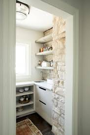 These corner diagonal cabinets maximize storage space with open cubbies for a microwave, small tv and cookbooks. Corner Pantry Ideas Design Ideas