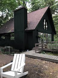 To find the best gray exterior paint for your home, consider the surrounding landscape and nearby architecture. Painting The Cabin Dark Green Deuce Cities Henhouse