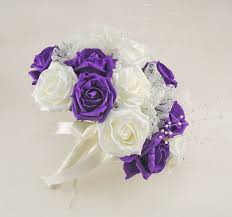 A classic choice for any elegant event, cream colored flowers set a relaxed tone of understated elegance. Purple And Ivory Rose Wedding Flower Package Pearl Strands Lace Bri Budget Wedding Flowers