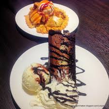 A dark cocoa cake covered with two kinds of chocolate. Jom Makan Life Longhorn The New Meat Ing Place