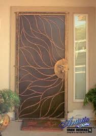 Whether you want a deadbolt or a keypad, we can add even more security to your customized. Custom Sun Wrought Iron Security Door By Artistic Iron Works Las Vegas Nv Iron Security Doors Wrought Iron Security Doors Security Door Design