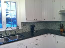 Backsplash for white kitchen with black countertop. What Exactly Is A Kitchen Update