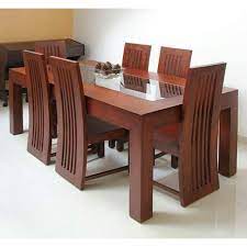 We eat at them daily, decorate them for holiday dinners, even work on them from time to time. 6 Seater Wooden Dining Table Rs 20000 Set Decor Design Unit Of Inayah International Id 19963084788