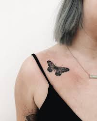 Black Small Butterfly Tattoo On The Right Clavicle Bone By Finley Jordan Black Butterfly Tattoo Clavicle Tattoo Small Butterfly Tattoo