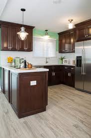 Pin By Paula Lawrence On Kitchen Ideas Dark Wood Kitchen Cabinets Cherry Wood Kitchen Cabinets Green Kitchen Walls