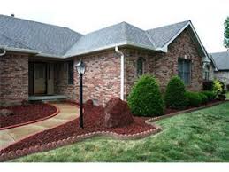Replace Mulch With Lava Rock Yes Sometimes It Works Beautifully Like With This Home In Center Grove Townhouse Landscaping Lava Rock Landscape Backyard Oasis