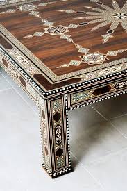 The natural finish on the wood brings out the beauty of the grain and the true color of the walnut. Deluxe Arabesque Coffee Table Intarsia Inlay The Ancient Home