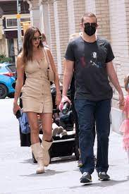 Her swimsuit shoots have taken her from arizona to italy and her native russia. Irina Shayk Walks With Bradley Cooper In A Beige Minidress