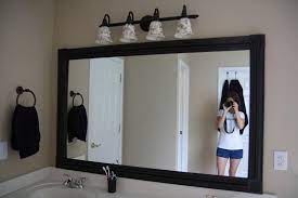 How to frame in a bathroom mirror: Crafty Again Mirror Frame Diy Diy Bathroom Diy Light Fixtures