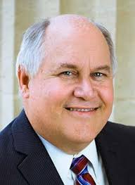 Board lets Congressman Estes use title