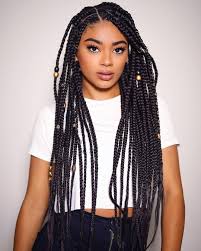 Box braids are a favorite for many, but this style is great to show off curl definition and versatility. Brownish Blonde Box Braids Novocom Top