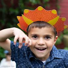 Carefully remove the cut designs from the mat and fold the dinosaur spikes using the scored lines as guides. Diy Dinosaur Headbands For Kid S Birthday Party Lia Griffith