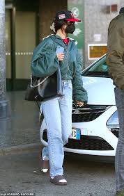 Posted on october 22, 2017 by lous. Bella Hadid Looks Casual In A Green Jacket And Brown Sliders Worn With Socks At Milan Airport Todayuknews