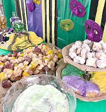 An essential mardi gras tradition, king cake is shaped into a ring and decorated with green, purple, and gold. Family Friendly Mardi Gras Party