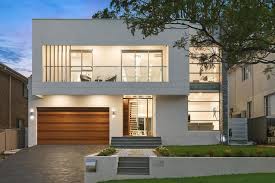 This two storey house has a clean facade that mixes different elements together: Double Storey House Designs Novocom Top