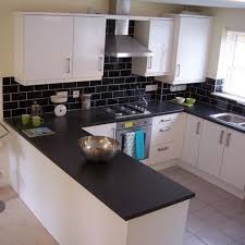 Let's take a look at the cool black and white kitchen idea below that. Stylishly Simple These Stunning Black Gloss Wall Tiles Are Perfect Wall Tiles For Kitchens Or B Grey Kitchen Wall Tiles Grey Kitchen Walls Brick Tiles Kitchen