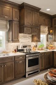 For color selection, it translates to 60% of a dominant color, 30% of a secondary color, and 10% for the accent color. One Piece Hood With Storage Space And Glaze Finish Schuler Cabinetry At Lowes In 2020 Trendy Farmhouse Kitchen Farmhouse Kitchen Cabinets Stained Kitchen Cabinets