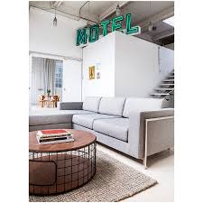 The honestly crafted surface is supported by a black, solid steel base that adds a raw element of contrast to this dynamic design. Gus Modern Wireframe Walnut Coffee Table Eurway