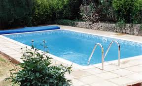 Insert a vacuum cleaner hose through the skimmer hole. Inground Swimming Pools Pool Desing Installation
