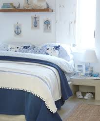 While sticking with navy wood panels, this room takes its inspiration from traditional vertical and horizontal nautical stripes. Beach Themed Bedrooms Coastal Bedrooms Nautical Bedrooms