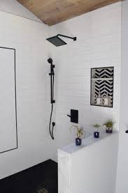 Subway tiles on the backsplash, porcelain tiles with granite look, and brushed aluminum profiles that match the appliances create this contemporary kitchen. Finishing Edge For Subway Tile In Bathroom