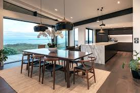 Because a chandelier is often positioned as lighting above a dining table, it typically sits above the center of the table. Lighting Design Different Style Ideas For Lighting Above Your Dining Table Lighting Design Nz