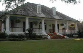 Acadian style house with wrap around porch. Pin On Farmhouse