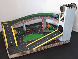Toy Car Play Mat With Lift And Parking Diy Tutorial Diy Toys Car Car Play Mats Toy Car Garage