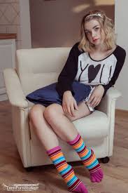 Young blonde sinks a couple of fingers in her pussy after stripping to socks  - PornPics.com