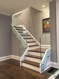 While it helps to block harsher winds, the small gaps between the glass and the posts and handrail allow you to enjoy mild breezes. Shower Door Of Canada Inc Glass Showers Glass Railing Glass Stair Railing