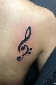Treble clef can be a good female tattoo , he often painted in the decomposition of other female. Tattoo Uploaded By Faz Fivefive Treble Bass Clef 1173363 Tattoodo