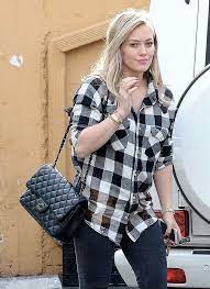 Check Out Our Favorite Celebrity Bag Looks From The Holidays Purseblog Striped Dress Outfit Chanel Jumbo Handbag Outfits