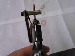 I always use, usually about a nickel thickness for setting up the depth of my machine. How To Set Up A Tattoo Machine For The First Time Tatring