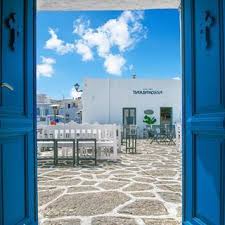 A View Of The Picturesque Port Of Naoussa Through The Open Door Of Saint Nicolas Church Paros St Nicolas Picturesque Views