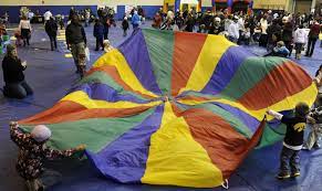 Great for team building & enhancing communication skills among young kids, this fun activity is sure to keep your students excited for pe. Four School Children Still Missing In Giant Gym Class Parachute New Roman Times