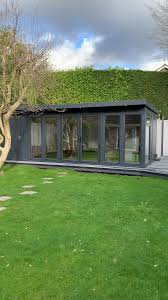 Combination Decking East Garden Garden Garage Ideas Grinstead Room Store Surrey In 2020 Summer House Garden Garden Cabins Garden Room