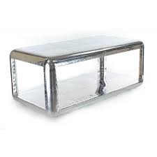 The handcrafted aluminum frames are a study in reductionist geometry, the elements pared back to the essential and angular lines softened with gentle, rounded curves. Rectangular Aluminum Coffee Table Baron Saulaie