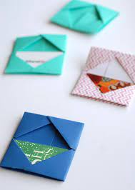 Next, take some thin cardboard or chipboard and glue the sleeve to it so it's sturdy. Paper Folded Gift Card Holders Gift Card Holder Diy Gift Card Diy Birthday Gifts