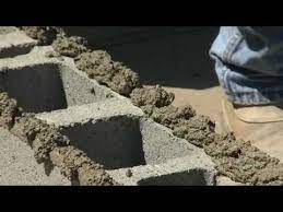 How To Build A Cinder Block Wall Bob Vila Cinder Block Wall Concrete Block Wall Concrete Blocks
