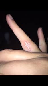 All of these finger tattoos are a reflection of the what unique finger tattoo ideas will you find on this list? Cross Finger Tattoos Finger Tattoos White Finger Tattoos