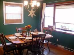 Beauty meets comfort in the dining room. Country Dining Room Painting Idea Hunter Green Wall Color Green Wall Color Country Dining Rooms Room Paint